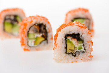 Four pieces of california roll with tiger shrimp in caviar. Sushi with cucumber and cream cheese inside isolated.