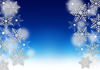 銀色のラメの雪の結晶　青のグラデーション背景　ふわふわの白のドット　冬のフレーム素材