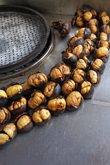 Closeup grilled chestnuts on snack cart