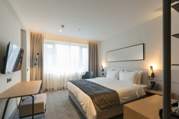 Interior of a luxury master bed hotel bedroom
