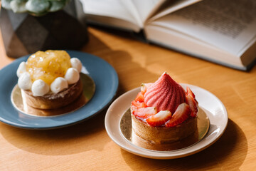 Sweet strawberry cupcake on the wooden table
