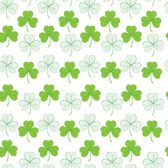 Seamless pattern with green leaves of clover on a white background. Suitable for congratulations to the St. Patrick's day, cards, patterns, logos, textiles, packaging.