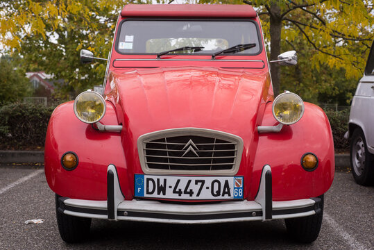 Mulhouse - France - 11 October 2020 - Front view of red 2CV6 parked in the street