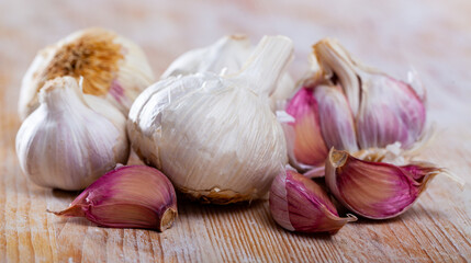 Many garlic on a wooden surface. High quality photo