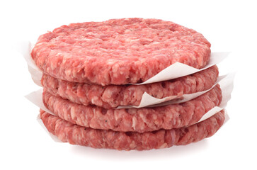 Uncooked raw beef chops burger in stack isolated on white
