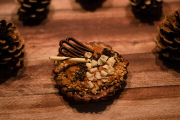chocolate tartlet decorated with white chocolate crumbs