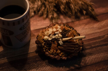 chocolate tartlet decorated with white chocolate crumbs
