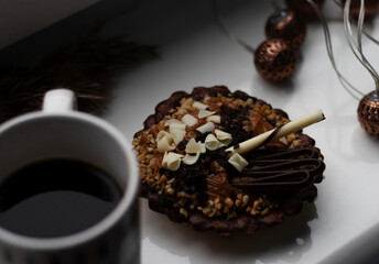 chocolate tartlet decorated with white chocolate crumbs