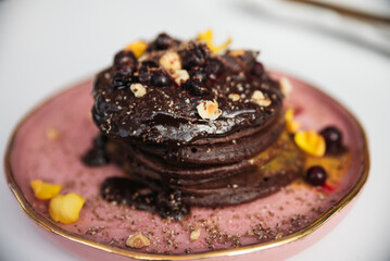stack of pancakes with chocolate sauce