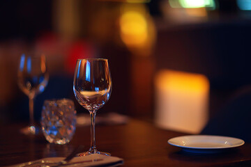 glass white wine restaurant interior, abstract evening dinner with alcohol at the bar