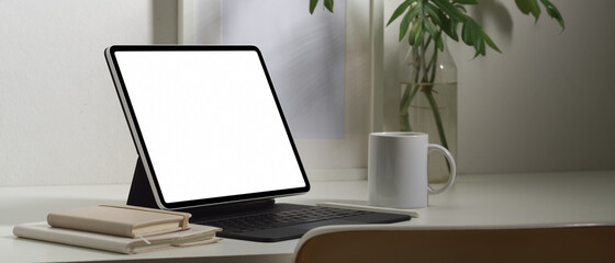 Side view of digital tablet with keyboard and stationery, include clipping path