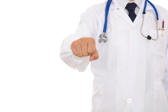 The Doctor In A White Coat Stretches Out His Hands And Fists To Strike Forward