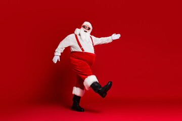Fototapeta na wymiar Full length body size view of his he attractive cheerful cheery funny fat white-haired Santa going wearing festal look isolated bright vivid shine vibrant red burgundy maroon color background