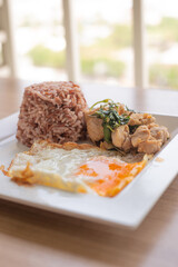 stir fried sweet basil with belly  pork and fried egg on rice
