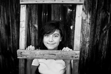 Portrait of teengirl in the village. Black and white photography.