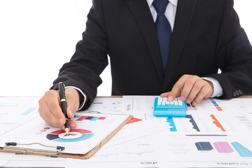 Financial practitioners in suits and ties are using calculators and comparing financial materials to analyze trends