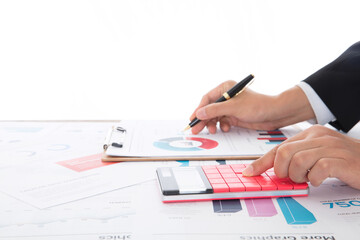 Close-up shot of accountant using calculator to analyze market
