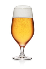 Glass of light yellow beer isolated on white.