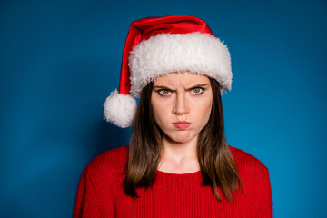 Where chirstmas party gift present close up portrait sullen anger girl grimace have bad mood newyear event wear season winter outfit santa claus hat isolated gradient blue color background