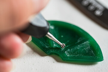 Jeweler making the wax model of the pendant