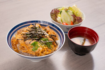 Katsudon japanese set meal , deep fried pork with egg egg with miso soup