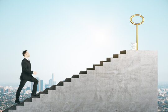 Businessman Climbing Stairs With Key