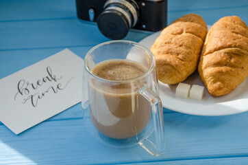 still life of cake with cup of coffee highlighted by sunlight