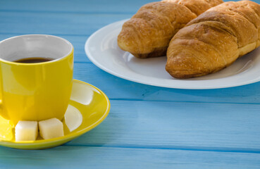 still life of cake with cup of coffee highlighted by sunlight