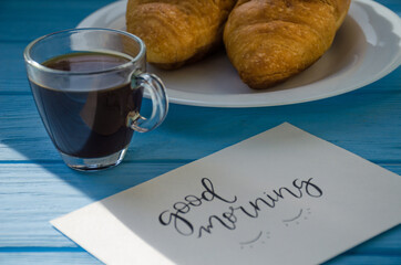 still life of cake with cup of coffee highlighted by sunlight