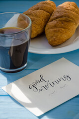 still life of cake with cup of coffee highlighted by sunlight