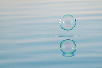 background with water surface and bubble bouncing off it