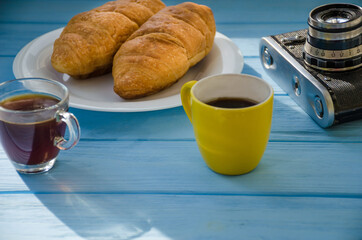 still life of cake with cup of coffee highlighted by sunlight