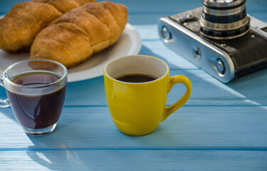 still life of cake with cup of coffee highlighted by sunlight