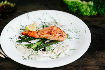 Baked salmon with asparagus and sauce