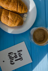 still life of cake with cup of coffee highlighted by sunlight
