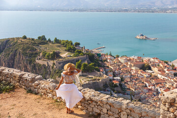 Backview woman on hill. Nafplion, Greece, Europe