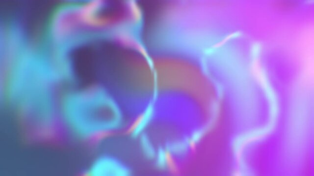 Abstract and smooth defocused foil background. Blur effect. Holographic gradient rainbow animation. Trendy vibrant texture in neon colors. Multicolored flowing liquid waves. 4K motion design animation