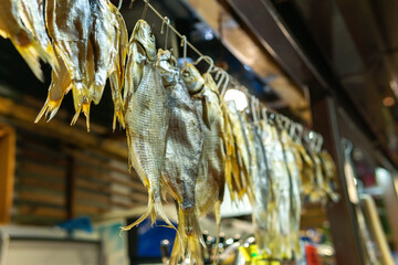 Popular ber snack - dried salty fish sold at the market. Street food.