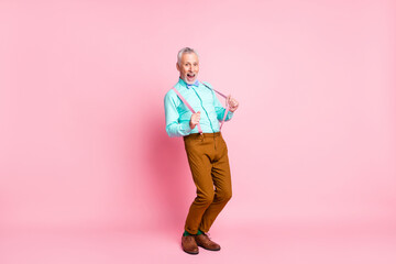 Photo portrait of funny cheerful old man wearing colorful outfit bowtie laughing isolated on pink color background