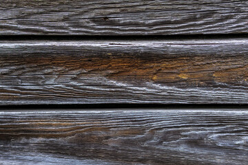 Naklejka premium brown old natural wood planks Dark aged empty rural room. logs inside vintage light warm interior