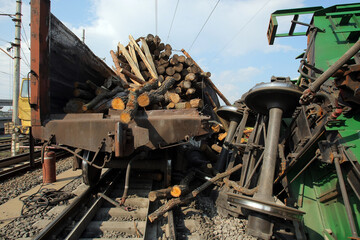 Fototapeta premium Railway accident. Freight cars derailed. Destruction of railway infrastructure. Destruction of rolling stock. Wagons carrying wood.