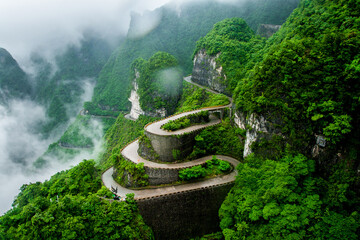 The winding road of Tianmen mountain national park (Zhangjiajie) in clouds mist, Hunan province,...