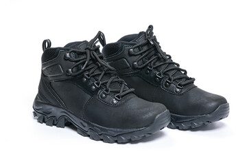 Pair of black leather winter sports shoes isolated on white background