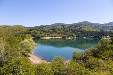 Fototapeta na wymiar Giacopiane lake is an artificial reservoir located in the Sturla valley in the municipality of Borzonasca, inland of Chiavari, Genoa province, Italy
