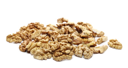 Unshelled walnuts pile isolated on white background