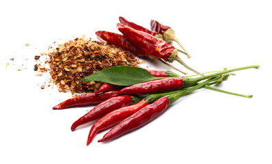 Fresh red spicy peppers with paprika flakes pile and green leaf isolated on white background