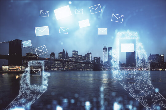 Double exposure of envelop hologram flying from gadget and city view background. Concept e-mail. - Powered by Adobe