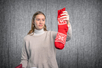 young woman is shocked by her Christmas gift