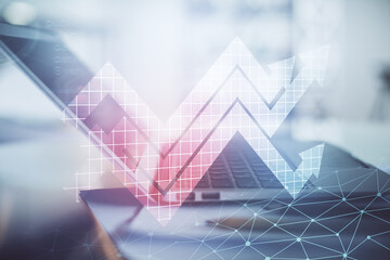 Computer on desktop with point up arrows hologram. Double exposure. Concept of success.