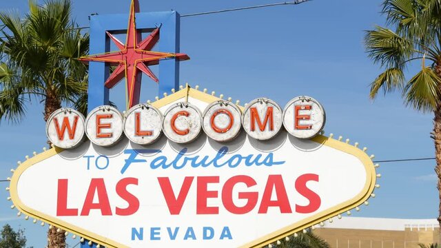 Welcome to fabulous Las Vegas retro neon sign in gambling tourist resort, USA. Iconic vintage banner as symbol of casino, games of chance, money playing and hazard betting. Lettering on signboard.